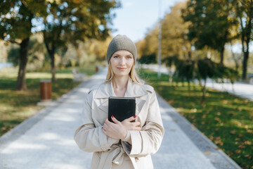 Peaceful autumn moment with woman admiring park scenery