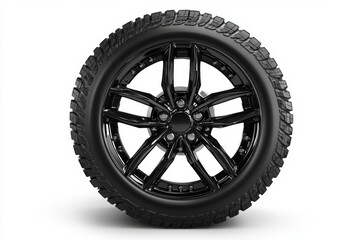 Obraz premium black car wheel and tire with alloy design and deep tread pattern