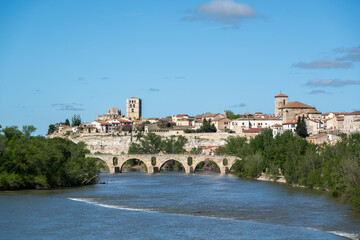 Fototapeta premium Zamora, Spain - April 17, 2024: Panoramic view of the city and the Duero River with the Stone Bridge