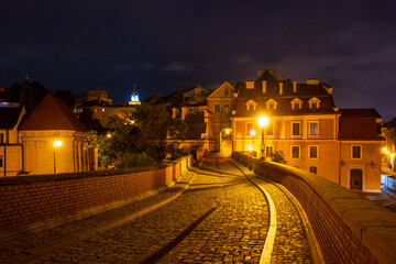 Cobblestone street leading to the Old Town in Lublin. Poland