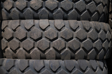 Rubber black tires stacked on top of each other