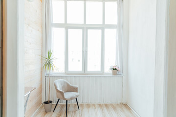 Interior of an empty white room with a window