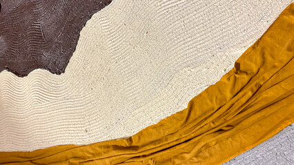 Abstract textured wall art with contrasting earthy tones, ideal for modern interior designs or as a creative background in commercial spaces