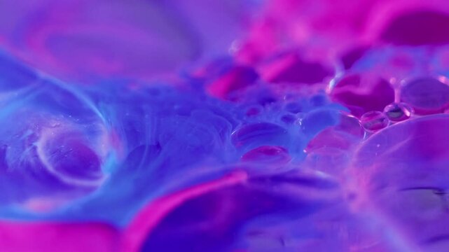 Acid blob. Oil foam. Blur fluorescent purple pink blue color gradient translucent soap texture fizzy ink water blend motion abstract art background.