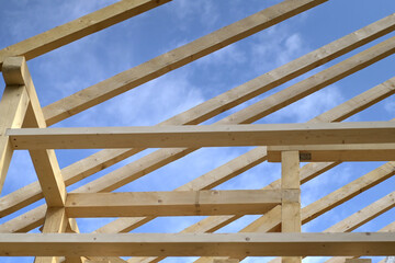Wooden roof frame house construction. Roofing construction.