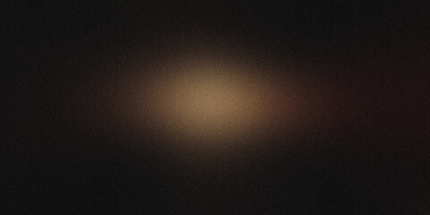 Obraz premium Subtle glow and textured effect created by a grainy light spot on a dark background