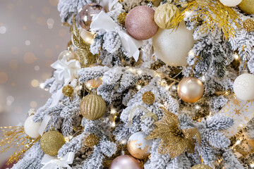 An elegant Christmas tree with lights. Christmas decorations.