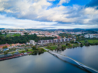 Obraz premium Aerial view of Coimbra city old town on the hill. Panoramic drone cityscape and Mondego River, Portugal