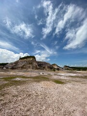 landscape with clouds, a blue sky,  in a hidden valley in the country side of South East Asia