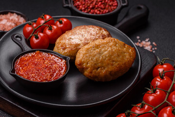 Delicious fresh fried minced fish cutlets with spices and herbs