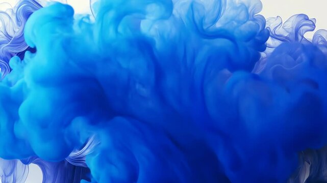 Watch a talented craftsperson manipulate blue silk into a mesmerizing, flowing art piece in a well-lit studio filled with creativity