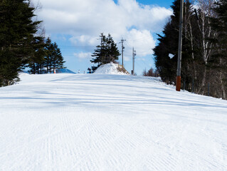 Groomed pistes at the ski resort of Sugadaira Kiogen in the mountains of Nagano, Japan