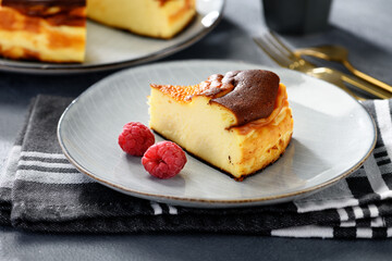 Piece of San Sebastian cheesecake . Traditional Spanish dessert.