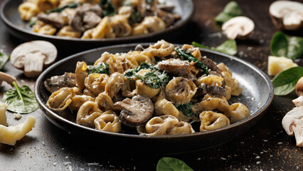 Chestnut Mushrooms and spinach tortellini served with parmesan cheese