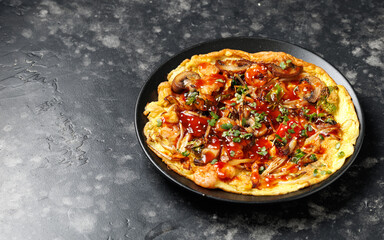 Foo Young Chinese egg omelette filled with vegetables, mushrooms, shrimp and sauce
