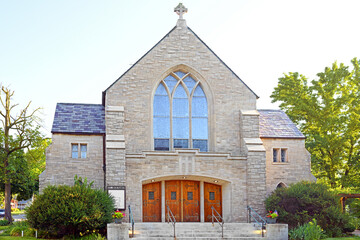 St. Bernard Catholic Church was built of Indiana limestone, of modified Gothic architecture, with...