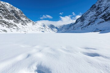 Breathtaking snowy mountain landscape with frozen lake