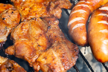 Deliciously Grilled Meat and Savory Sausages Prepared on a BBQ Grill for Ultimate Enjoyment