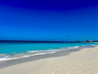 Turks and Caicos beach with turquoise waters, white sand, and lush greenery. A tropical paradise perfect for vacation, travel, nature, and beach photography, capturing the beauty of an exotic island