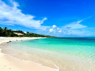 Turks and Caicos beach with turquoise waters, white sand, and lush greenery. A tropical paradise perfect for vacation, travel, nature, and beach photography, capturing the beauty of an exotic island