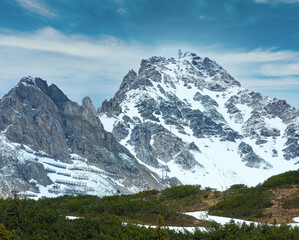 Summer alpine view with snow retention constructions on mountain (Warth, Vorarlberg, Austria).