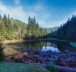 Carpathian mountain autumn landscape with lake.