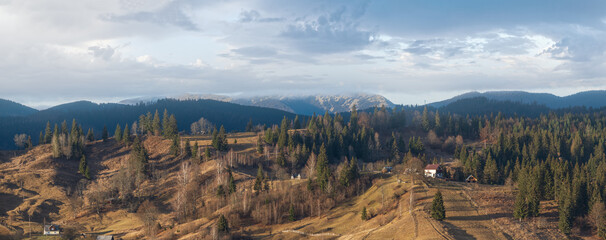 Picturesque morning above late autumn mountain countryside.  Ukraine, Carpathian Mountains. Peaceful traveling, seasonal, nature and countryside beauty concept scene.