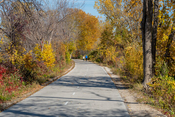 Fototapeta premium Couple Walking On The Fox River Trail Near De Pere, Wisconsin, In Fall