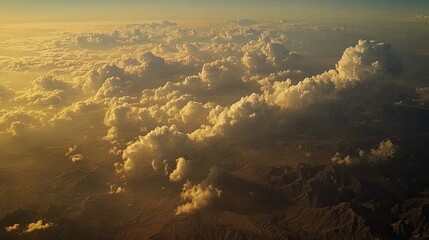 Aerial view of clouds,  mountains in the distance․