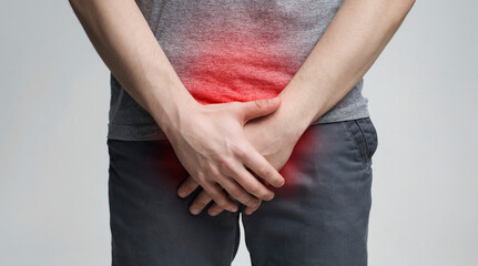 Erectile dysfunction concept. Close up of man holding his crotch. Men's health