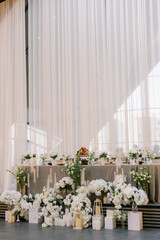Elegant wedding table decor with flowers and candles.
