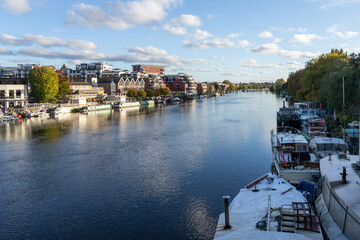 Fototapeta premium Kingston Upon Thames quayside with people enjoying the late afternoon sun