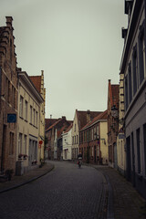 Typical beautiful streets in Bruges, Belgium. West Flemish. West Flanders. Cycling person. Street photography. Bike.