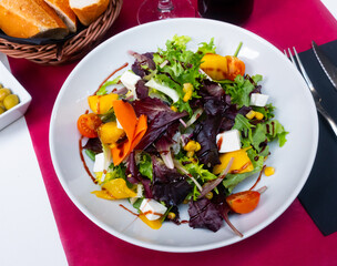 Healthy salad with arugula, vegetables and feta cheese
