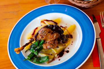 French style duck confit in port sauce served with pear chutney and baked jalapenos..