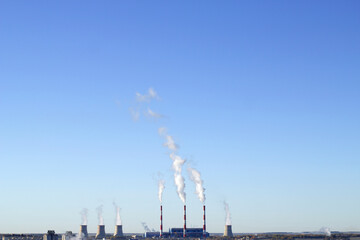 smoke from the chimney with blue sky background