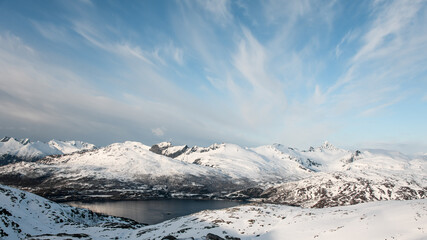 Top view from a distance of a beautiful mesmerizing mountain landscape with many sharp mountain peaks