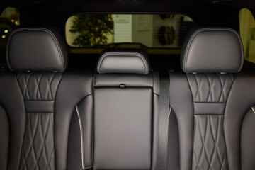 Car back seat with headrest and arm rest, a comfortable automotive fixture