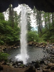behind a waterfall in the mountains