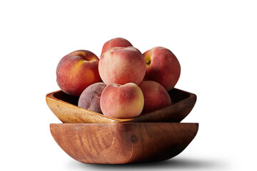 Peach a wooden bowl, isolated
