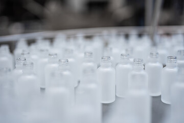 cosmetics production - glass vials on the production line