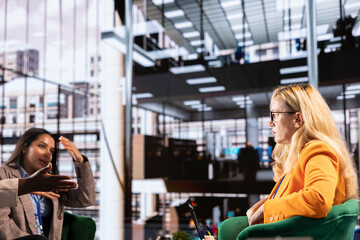 Confident group of women in a men dominated business environment strategizing to develop the company globally. Female empowerment, resilience and leadership driving corporate success.