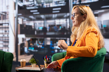 Female business leader in a professional office strategizing for development success, discussing with shareholders. Self accomplished woman driving innovation and gender equality.