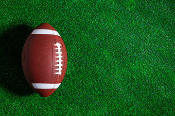 A football ball isolated on a green field