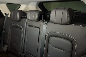 Obraz premium Car back seat with headrest and arm rest, a comfortable automotive fixture