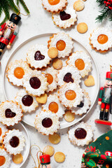 Traditional Christmas Linzer Cookies on a Christmas rustic background