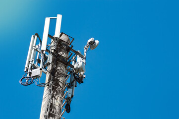 Close-up of 4G and 5G cell tower against the sky