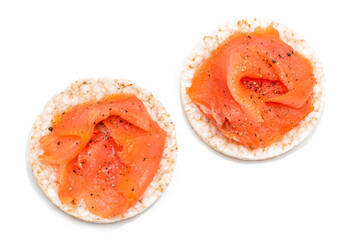 Tasty Rice Cake Sandwiches with Fresh Salmon Slices Isolated on White - Top View. Easy Breakfast and Diet Food. Crispbread with Red Fish. Healthy Dietary Snacks - Isolation