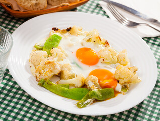 Appetizing cauliflower fried eggs for breakfast