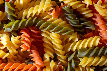 Uncooked Vibrant Colored Fusilli Pasta: A Mesmerizing Culinary Canvas of Multicolored Spirals,...